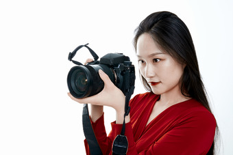 <strong>手持</strong>相机的亚洲年轻少女的肖像人像