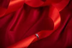 钻戒素材情人节红色丝绸背景