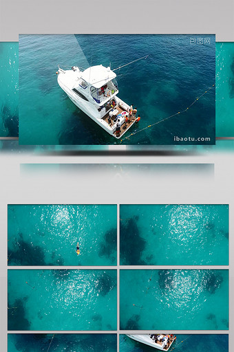 国外青色大海中一个人浮潜游艇边图片
