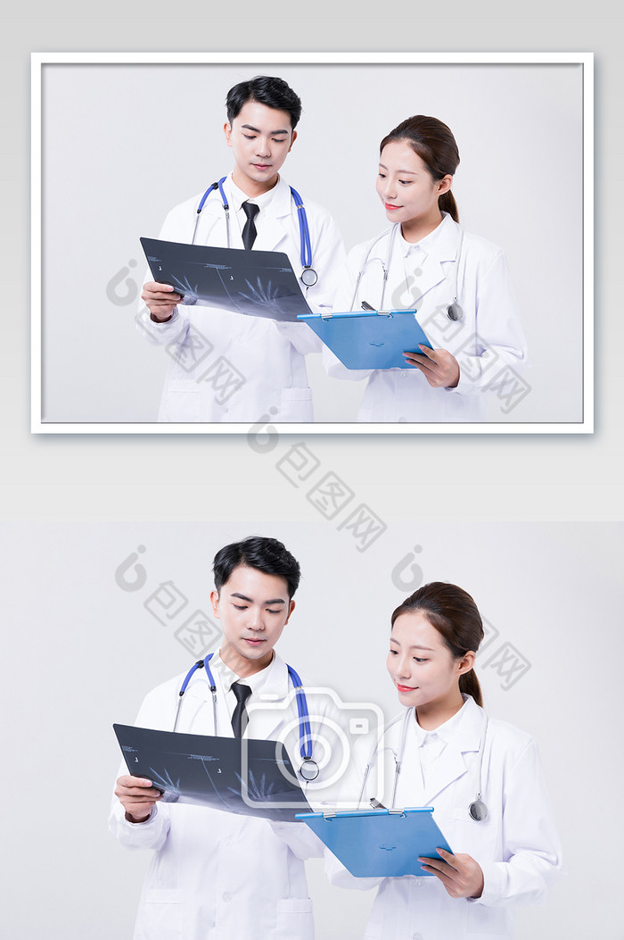 医生观察X光片病情讨论摄影图片图片