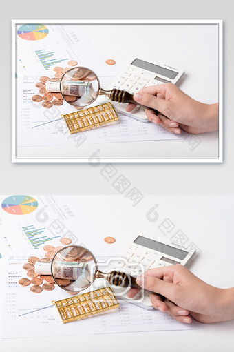一只手拿着放大镜分析金融概念摄影图片