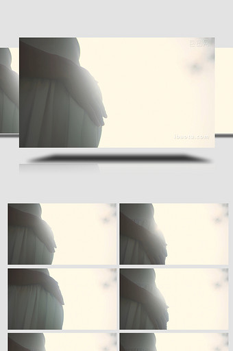 逆光拍摄孕妇手抚摸肚子孩子视频素材4K图片