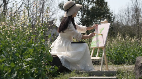 唯美春天人像女孩在户外写生实拍