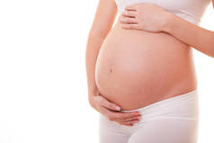 孕妇摸她的大肚子的图片。靠近点母亲、怀孕、人和期望的概念。怀孕妇女怀孕分娩