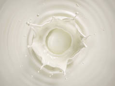 从顶部观察到的圆形波纹在牛奶池中的奶冠飞溅.