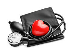 红色心脏的血压计在白色背景