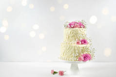 Wedding or Birthday 2 Tiered Cake with Bokeh Party Lights.