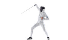 Thrust with rapier. Young man, fencer in in fencing costume with sword in hand training isolated on 