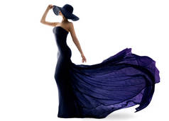 穿黑色紫色衣服，坐长途车回来的女人。夜光闪闪的华贵时装模特和优雅的帽子。在孤立的工作室白色背景上的魅力女性轮廓