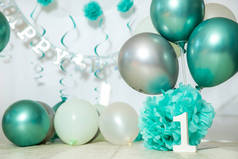 sliver, blue and white decoration for a 1st birthday cake smash studio photo shoot with balloons, pa