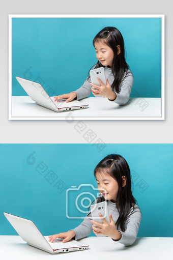 一手拿手机一手点击电脑键盘的小女孩图片