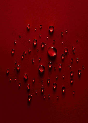 红色背景水珠广告素材摄影图