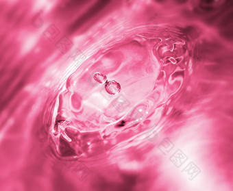 粉色水面水花摄影图