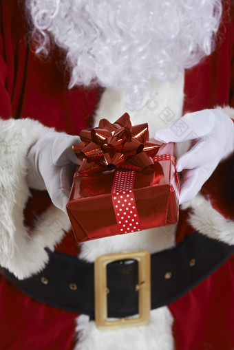 红色调送礼物的圣诞老人摄影图