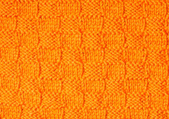 橙色毛线纹理摄影图