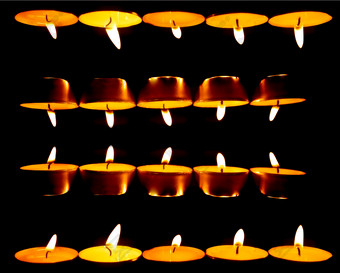 暗色调蜡烛的火苗摄影图