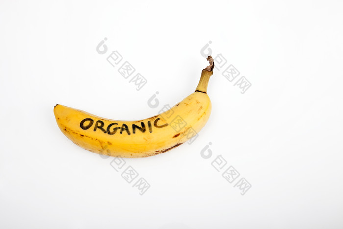 简约一个写字的香蕉摄影图