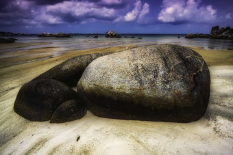 海滩海岸沙滩上岩石摄影图