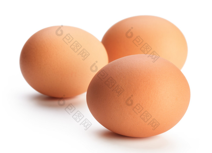 三颗椭圆的鸡蛋摄影图