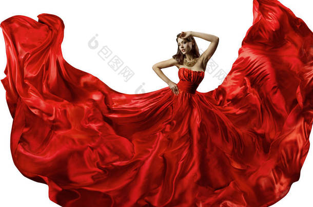 在红色的礼服，丝绸晚礼服，挥舞着面料时装模特舞蹈跳舞的女人