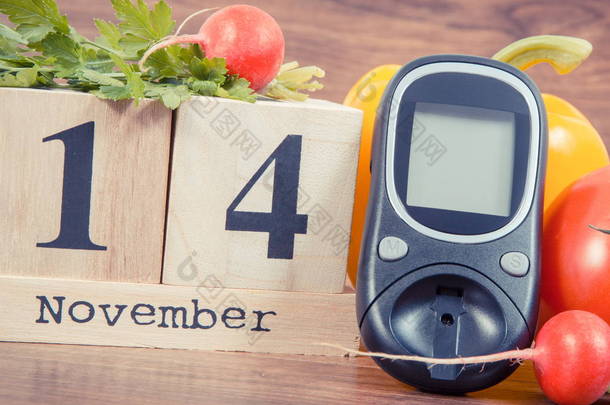 日期 11 月 14 日作为世界糖尿病日，血糖仪测量血糖水平和蔬菜的象征