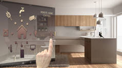 智能家居控制概念, 手控数字接口从移动应用. 模糊背景显示现代厨房, 建筑室内设计