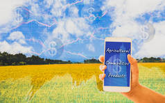 手持智能手机, 背景金矿和图表显示股票, 概念选择有机农产品和农业期货交易在世界市场上, 使用技术跟踪生产力