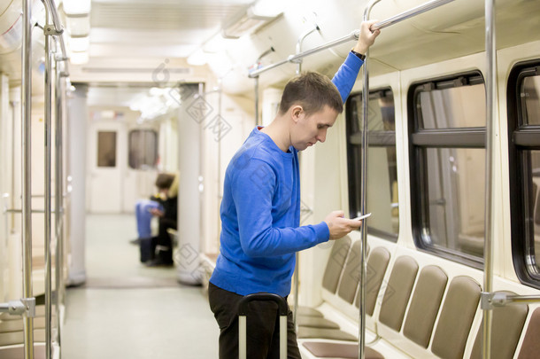 Young passenger in subway train