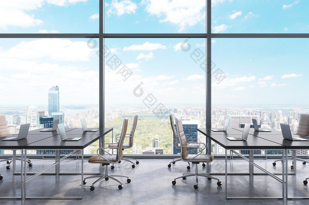 Workplaces in a modern panoramic office, New York city view from the windows. Open space. Black tabl