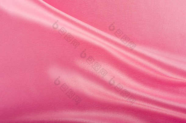 织物的粉红色丝绸褶皱