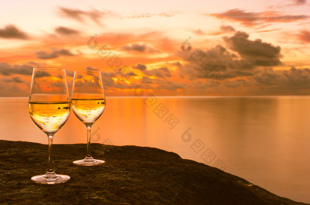 Wineglasses with ocean background