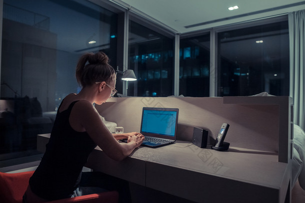 Young woman overworking in the office