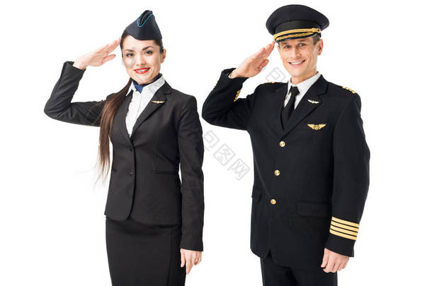 航空公司上尉和空姐敬礼在白色隔离