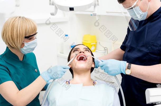 Dental cleaning, woman under treatment.