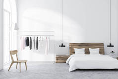 斯堪的纳维亚风格的卧室, 白色的墙壁, 瓷砖地板, 衣架, 和床头桌的主床。3d 渲染模拟