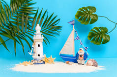 玩具帆船，沙滩上的船长，岛上有灯塔、海葵叶和棕榈树、海贝和海星