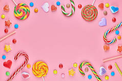甜糖果复制空间框与棒棒糖粉红色背景