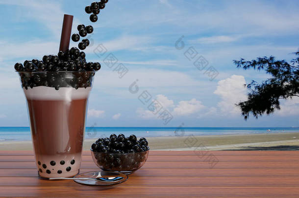 可可豆珍珠奶茶，将黑色珍珠或泡沫果冻放在透明的<strong>玻璃</strong>杯中，将棕色的稻草放在木制<strong>桌子</strong>上，模糊了大海和海滩的景色。3D渲染.