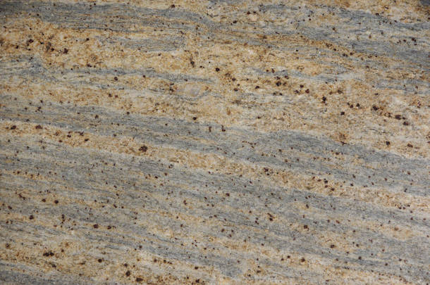背景天然石头灰色和米色与黑暗的斑点, 被称为花岗岩朱帕拉诺科伦坡