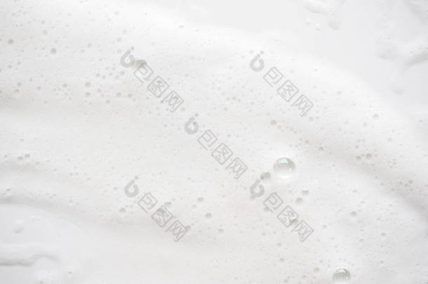 抽象背景白色肥皂泡沫纹理。洗发水泡沫与 