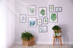 美丽的热带树叶画在生活的白墙上
