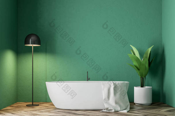 简约绿色浴室内有一个白色的浴缸, 一条毛巾挂在上面, 一棵盆栽树和一盏灯在角落里。3d 渲染模拟