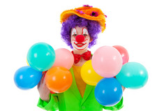 儿童打扮成多彩滑稽小丑与气球