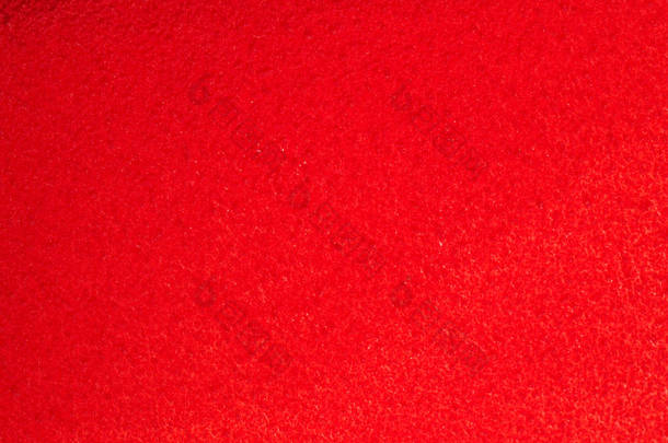 红色天鹅绒的质地。红布的背景。红色天鹅绒的背景