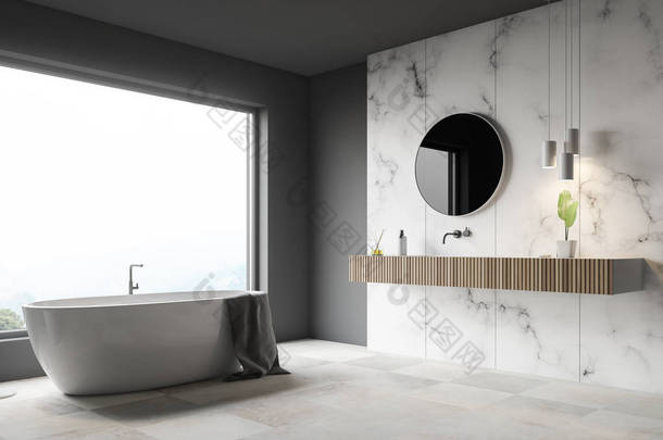 豪华浴室的角落, 有灰色和白色的大理石墙壁, 大窗户, 白色瓷砖地板, 白色浴缸和木水槽与圆形镜子。3d 渲染