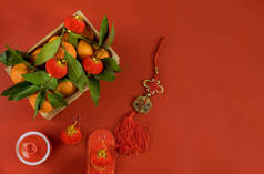 用红色背景的传统集装箱柑橘装饰元宵节饰物