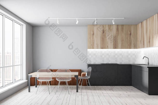 <strong>现代厨房</strong>的内部, 白色墙壁, 木地板, 灰色台面和木制橱柜和木桌与棕色沙发和透明椅子。3d 渲染