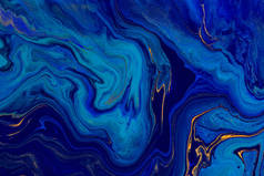 手绘背景，混合液体蓝色和金色油漆。抽象流体丙烯酸绘画。现代艺术。大理石蓝色抽象背景。液体大理石图案