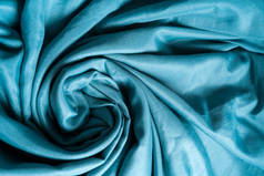 蓝色亚麻布形成了各种抽象的图案.蓝色面料,波纹面料