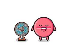 cute medicine tablet is standing in front of the fan , cute design